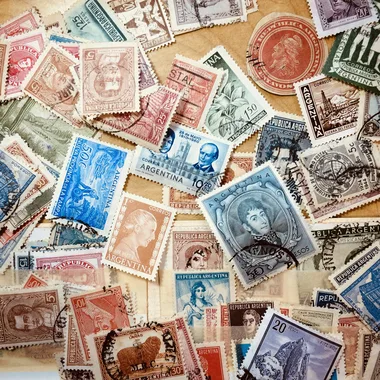 assorted coins on brown wooden table
